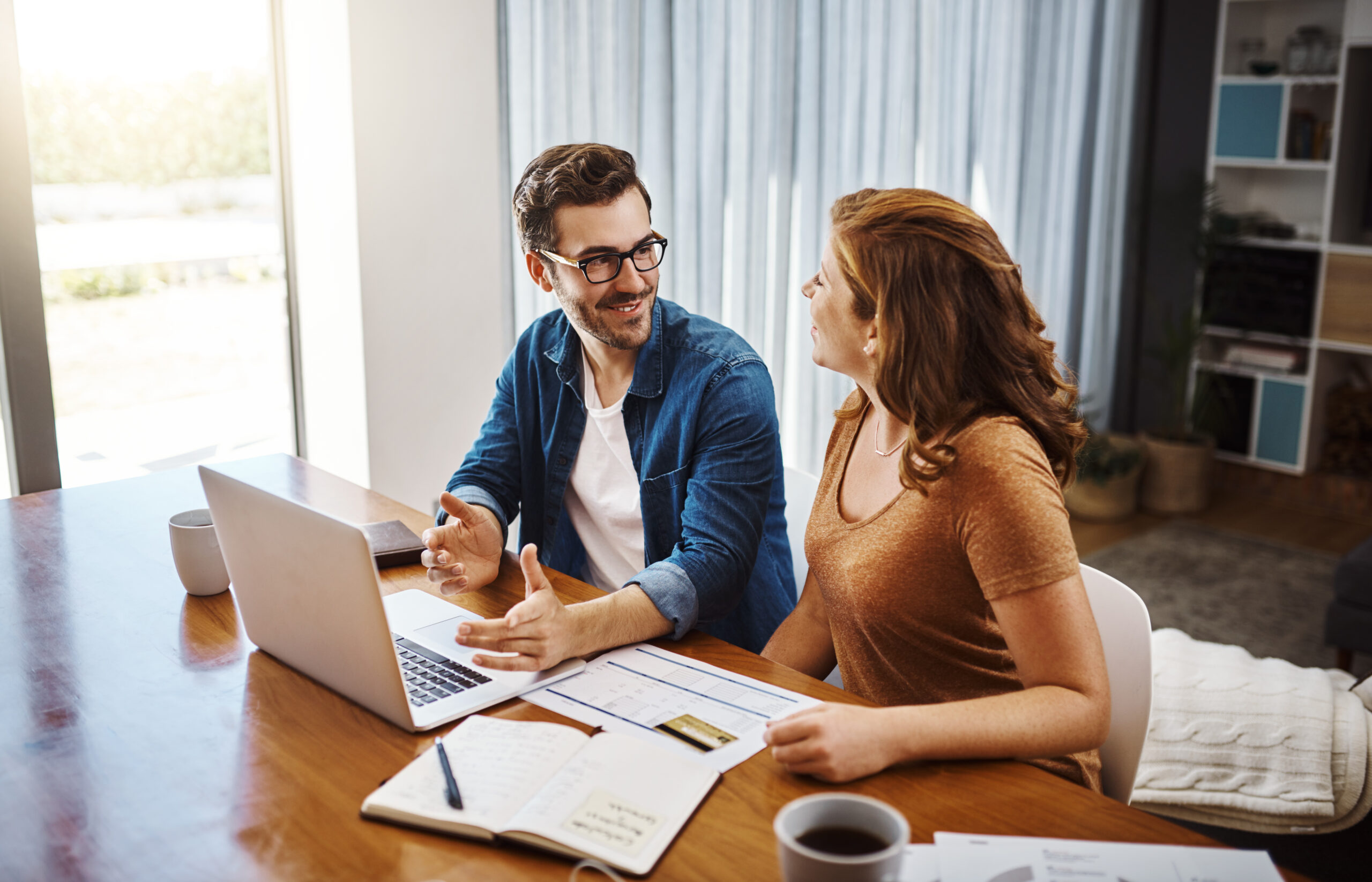 Couple looking through block management accounts.