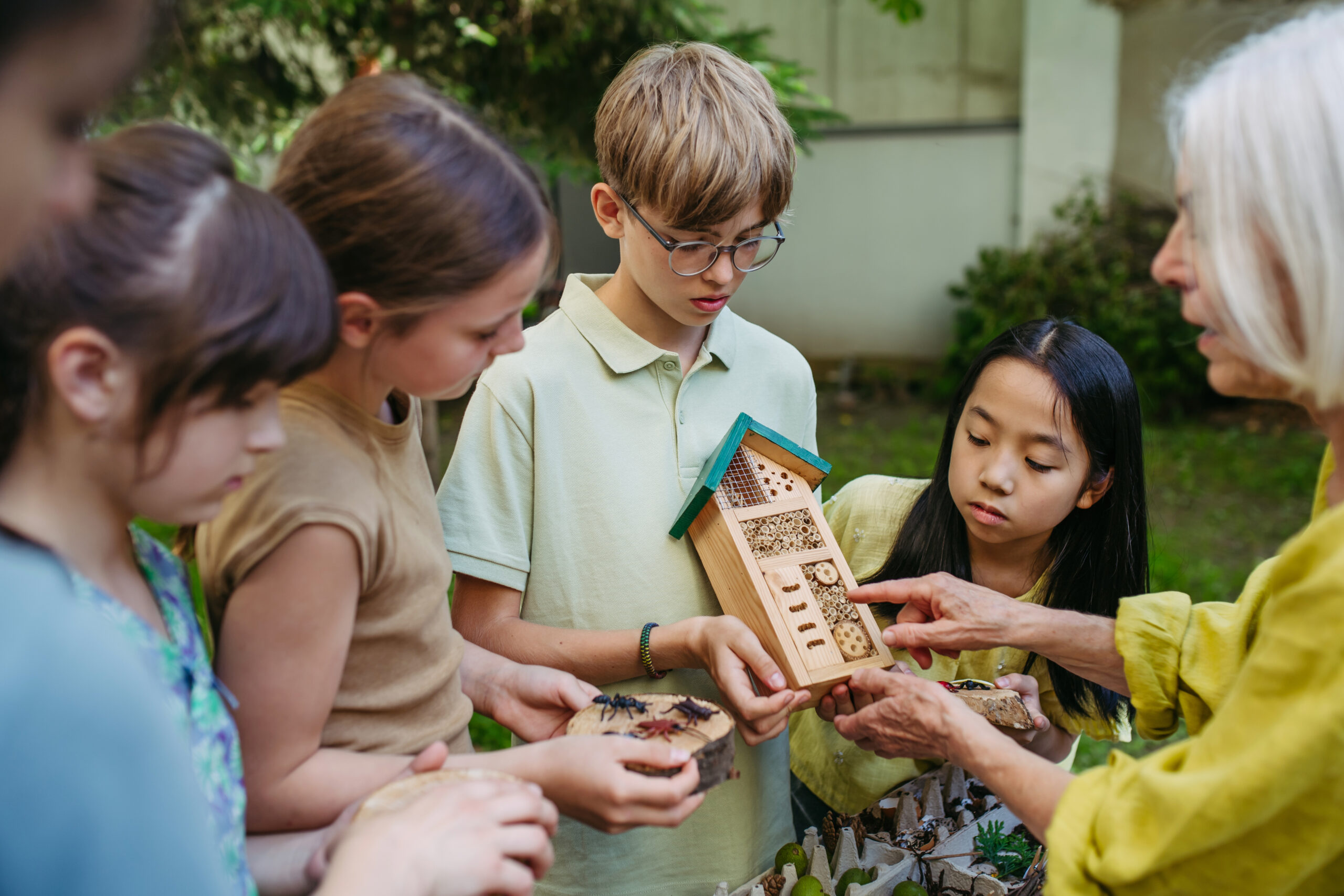 kids learning about the environment outside.