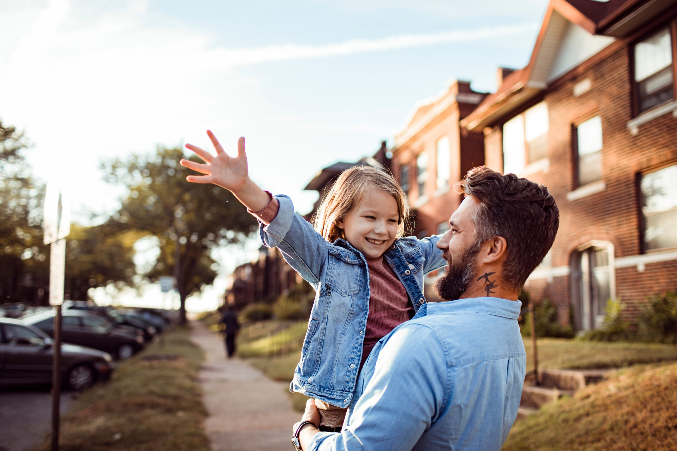 Man and child in housing estate.